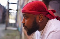 a man wearing a red bandana